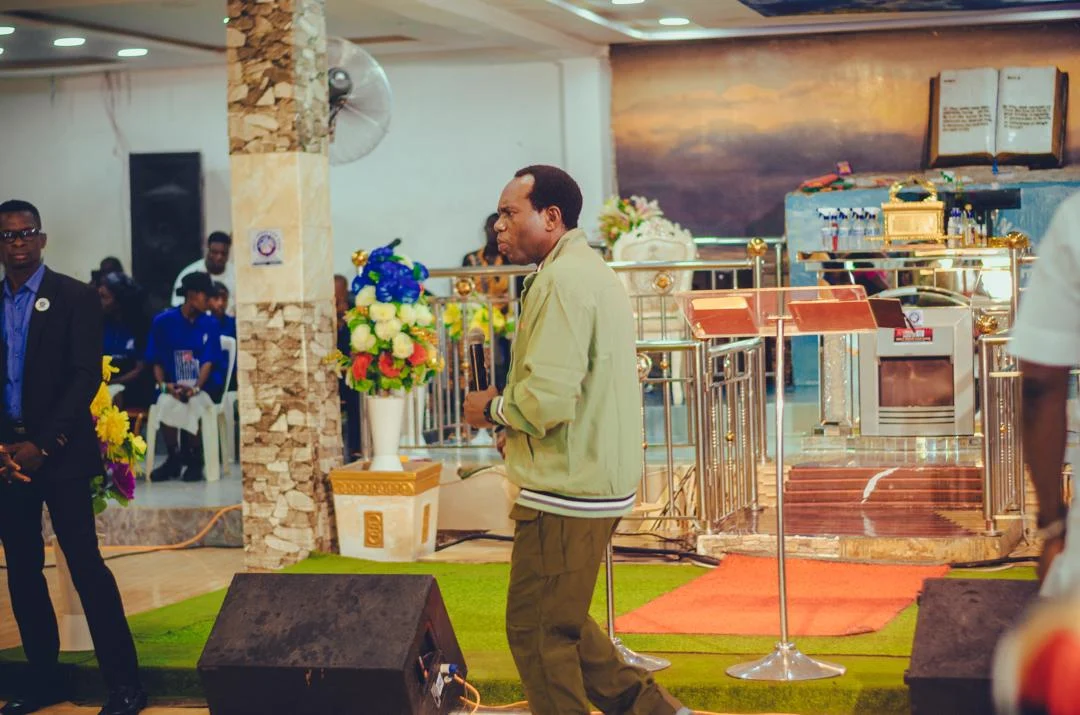 Pastor leading worship at the sanctuary altar