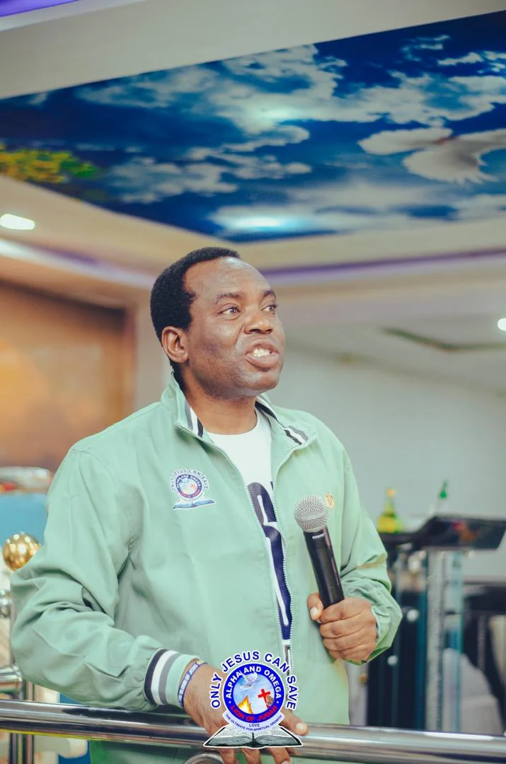 Pst. Akpos Joseph Ekiegha JP in worship under sanctuary celestial ceiling